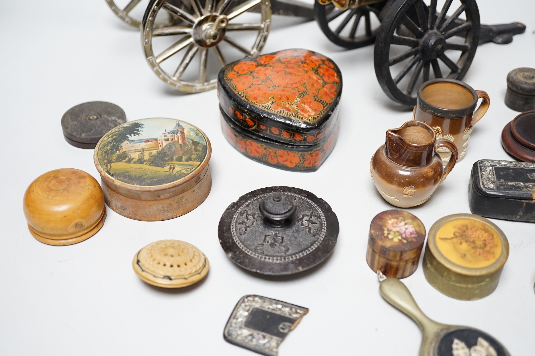 Two metal models of field cannons and sundry small boxes, in treen, white metal and papier-mâché